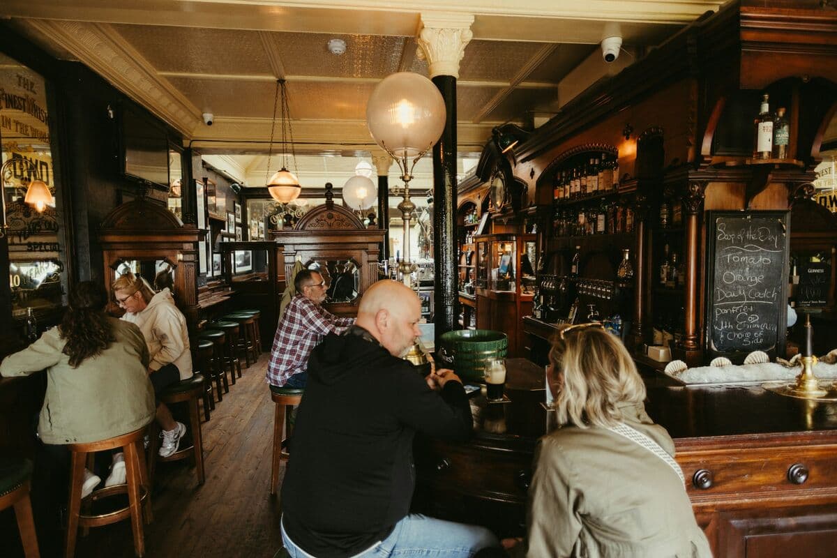 Drinkers in a traditional pub interior