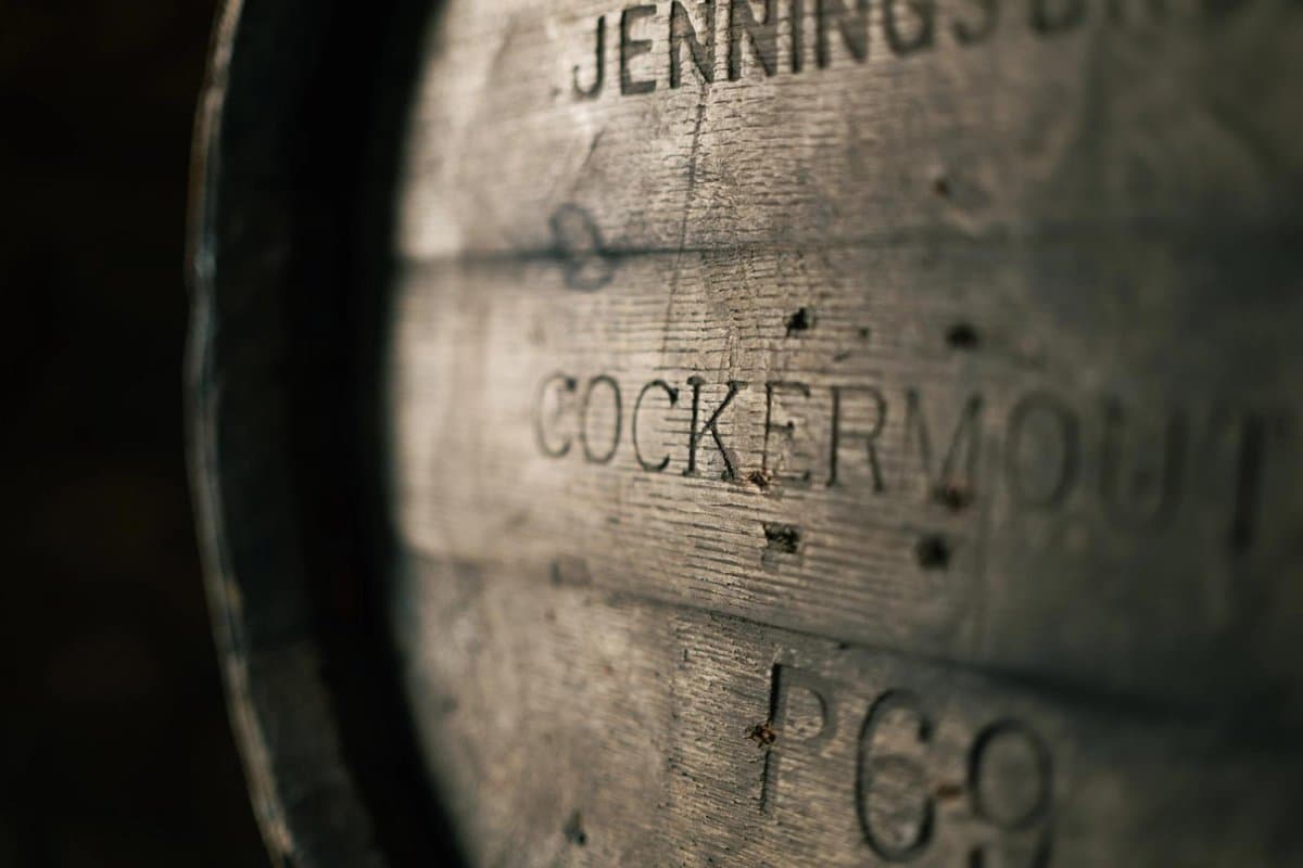 Close-up of a wooden cask stamped Jennings and Cockermouth