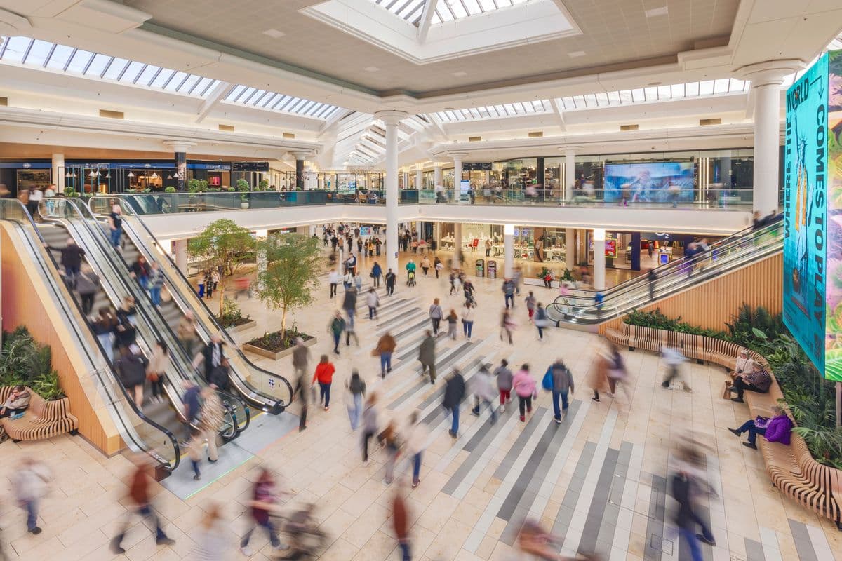 Shoppers walking through the Metrocentre's main mall