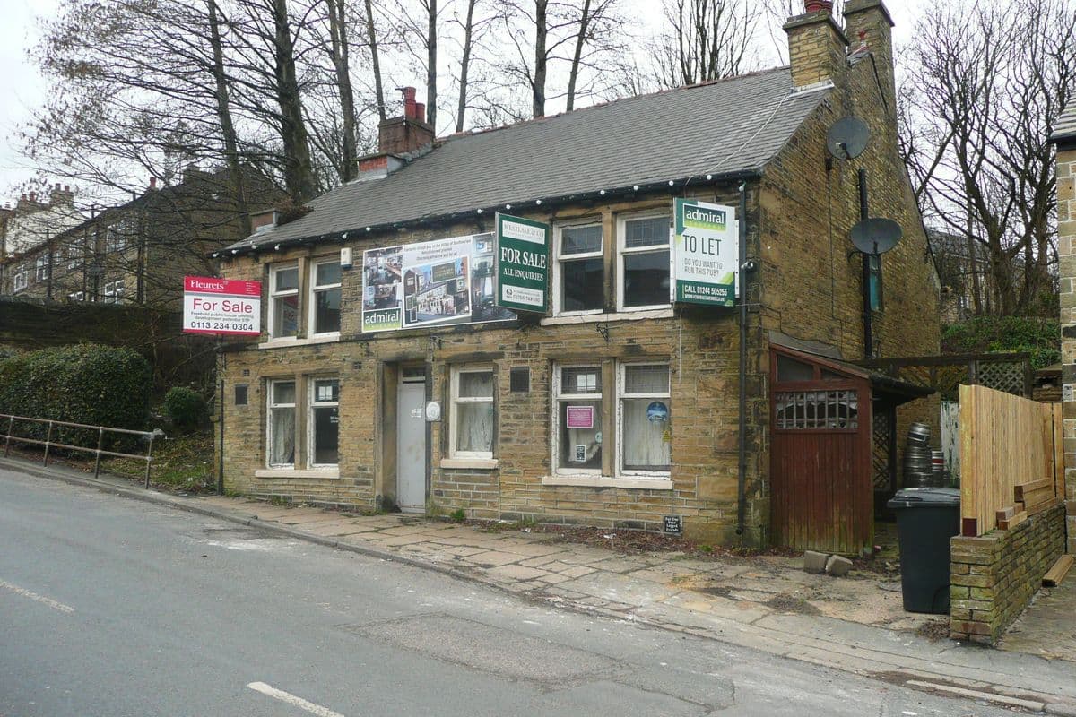 A stone-built pub called The Admiral with For Sale and To Let boards on the front