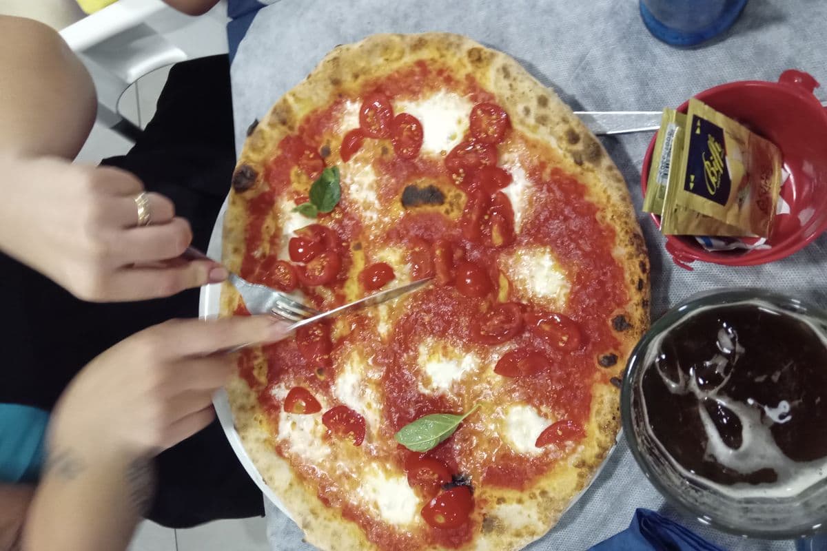 A Margherita pizza on a wooden board