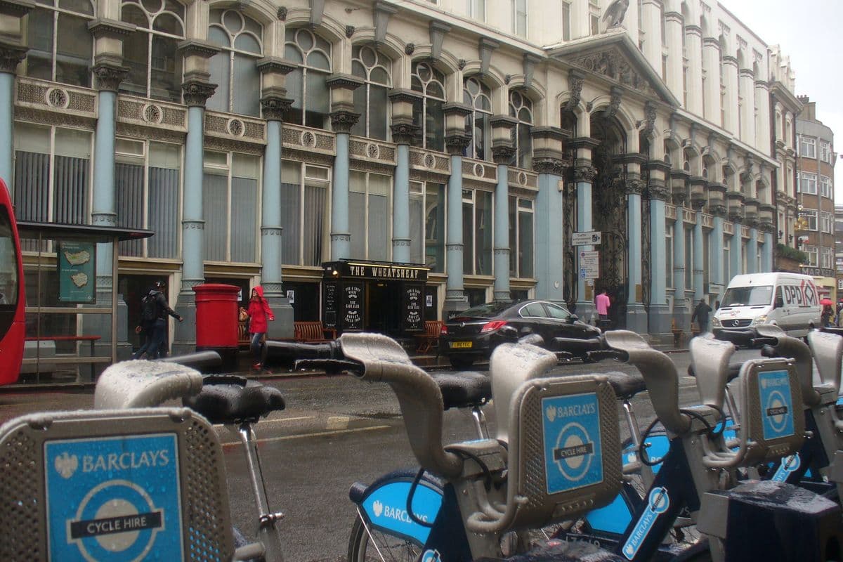 The Victorian Hop Exchange building on Southwark Street in London, with hire bikes in front