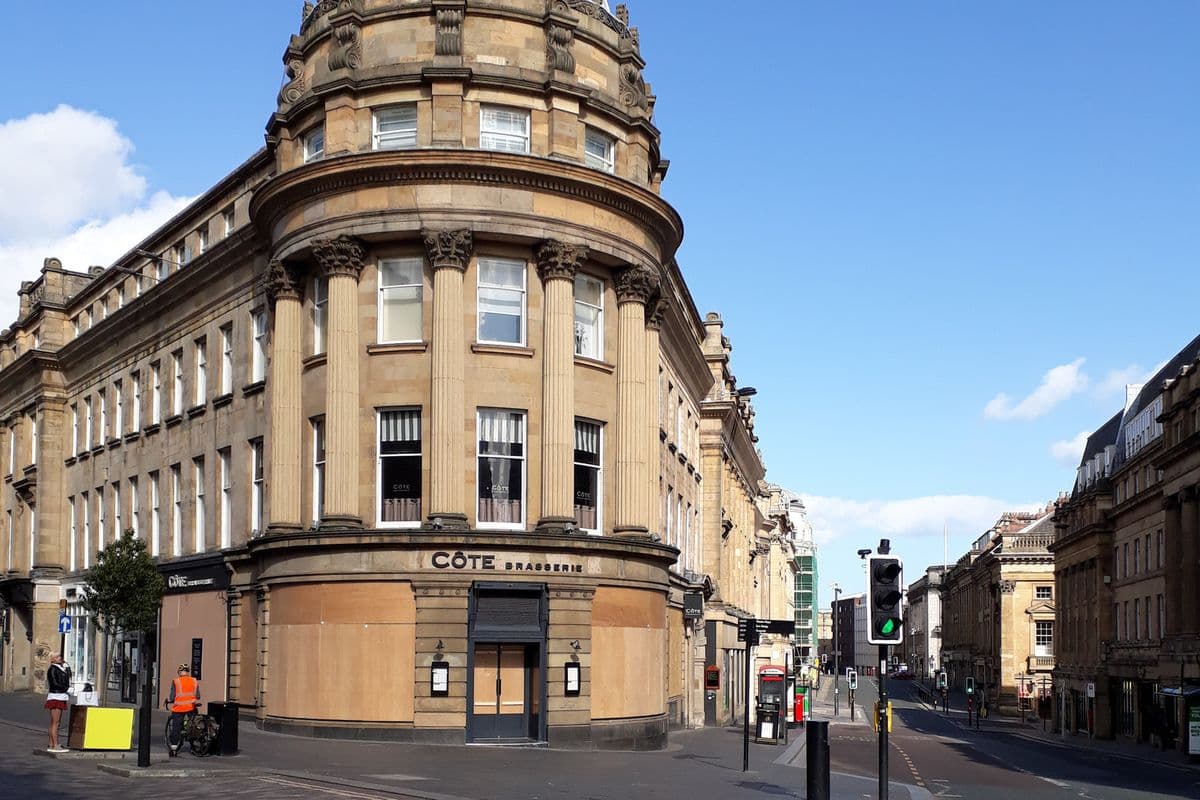 A boarded-up restaurant frontage on a Newcastle street