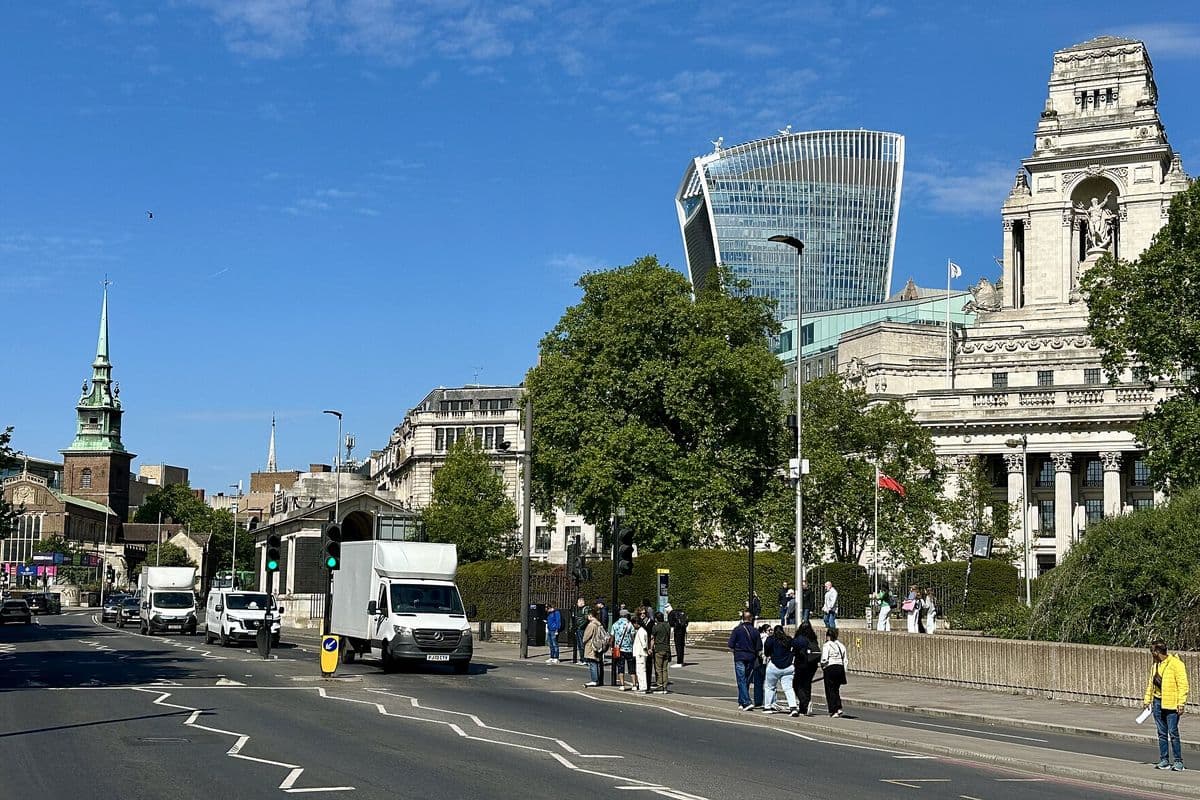 Tower Hill in London with the Tower of London walls and a busy street