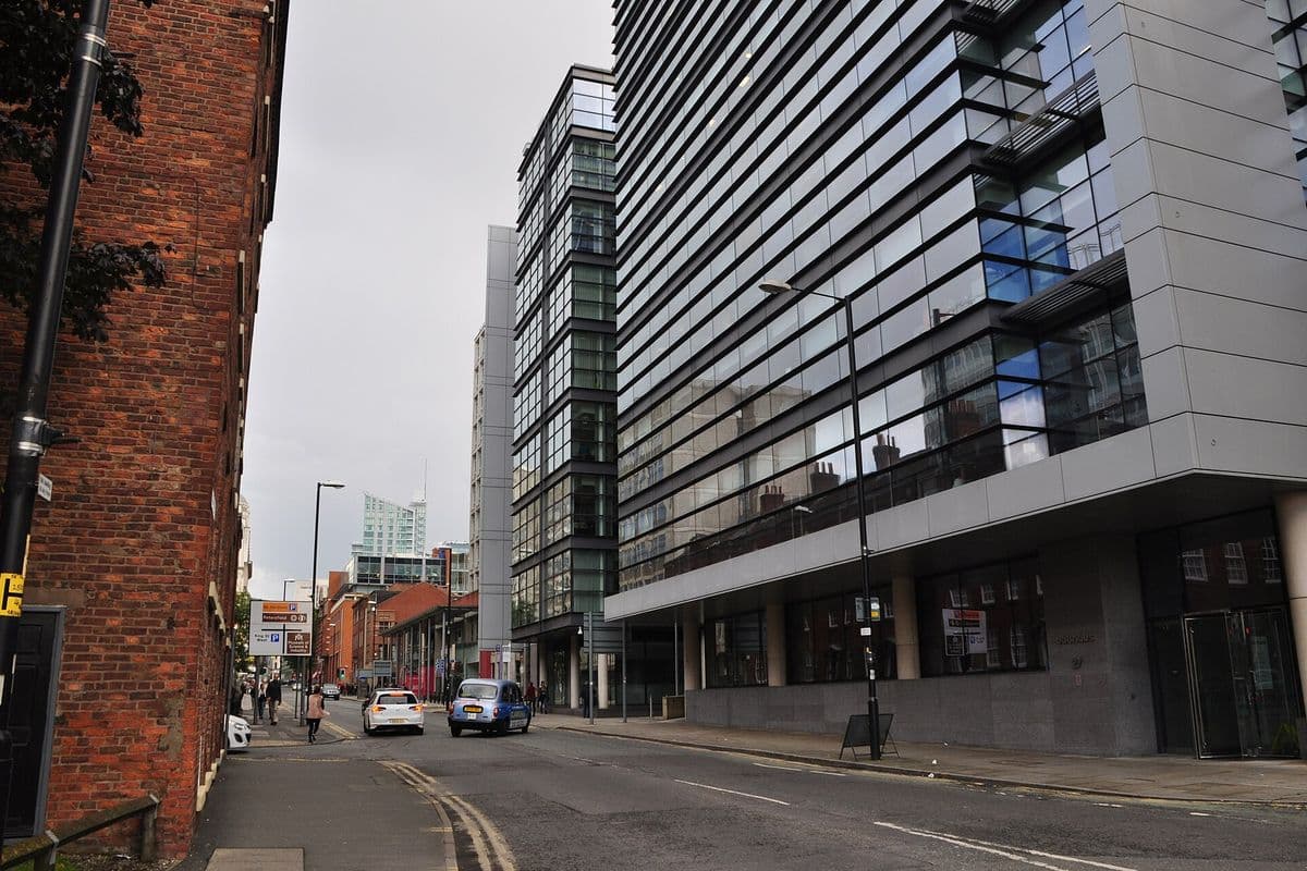 Quay Street in Manchester with traffic and city buildings