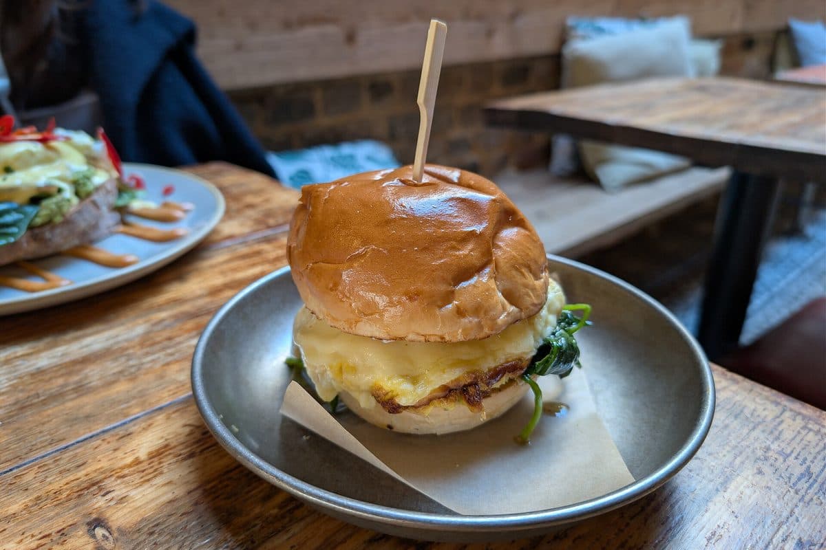 An egg and avocado breakfast bap on a plate (generic image, not a Yolk product)