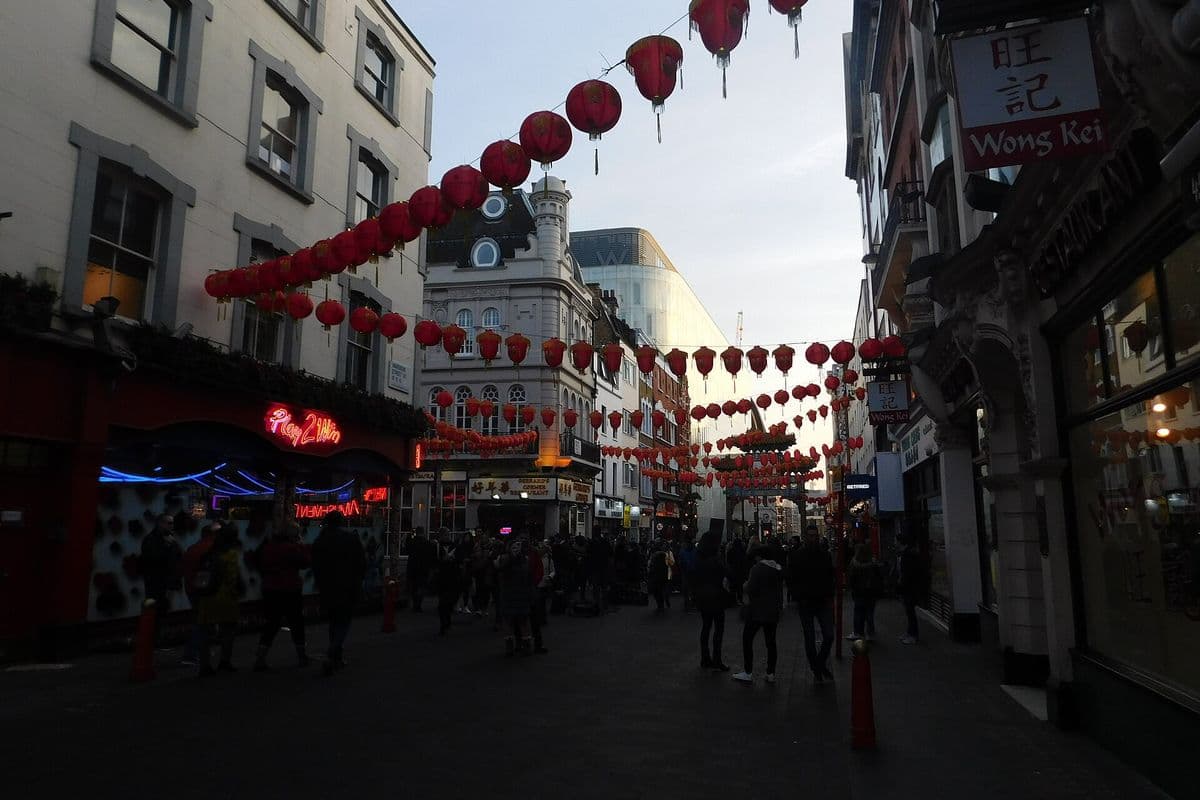 Red lanterns strung across Wardour Street in London's Chinatown
