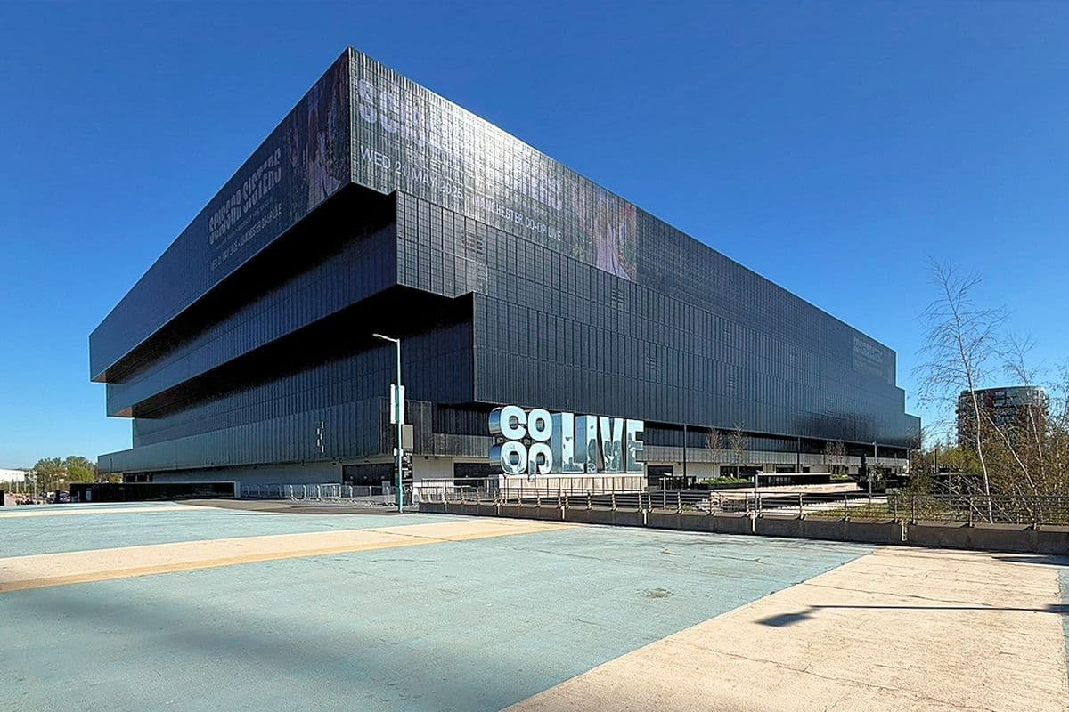 The Co-op Live arena at the Etihad Campus in east Manchester under a blue sky