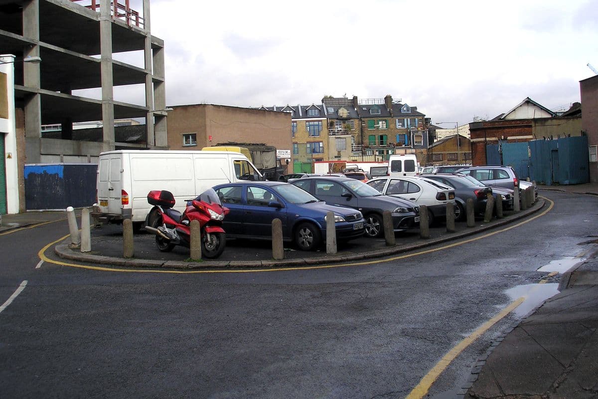 The Oval, a small street in Bethnal Green near Cambridge Heath, with parked cars and warehouse buildings