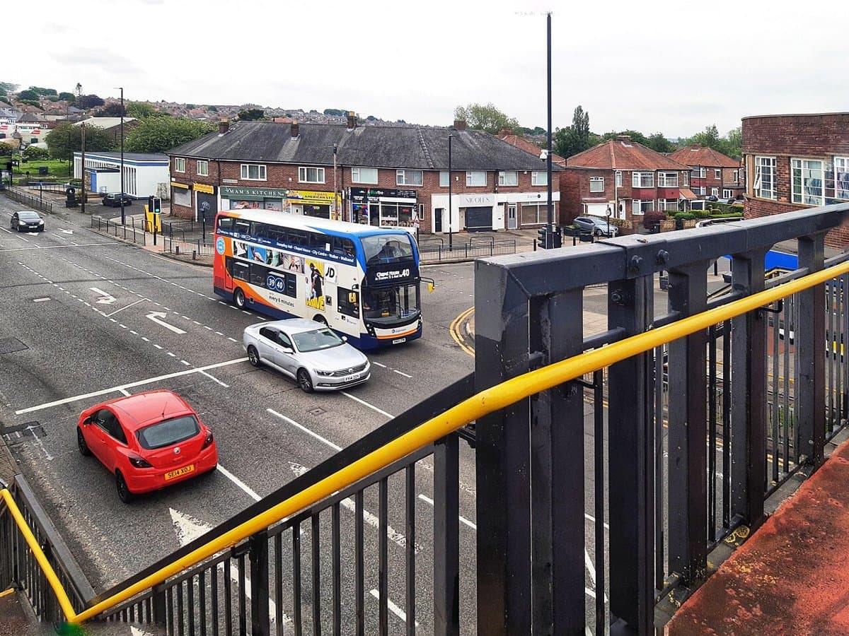 Shops and traffic on the West Road in Denton Burn, Newcastle