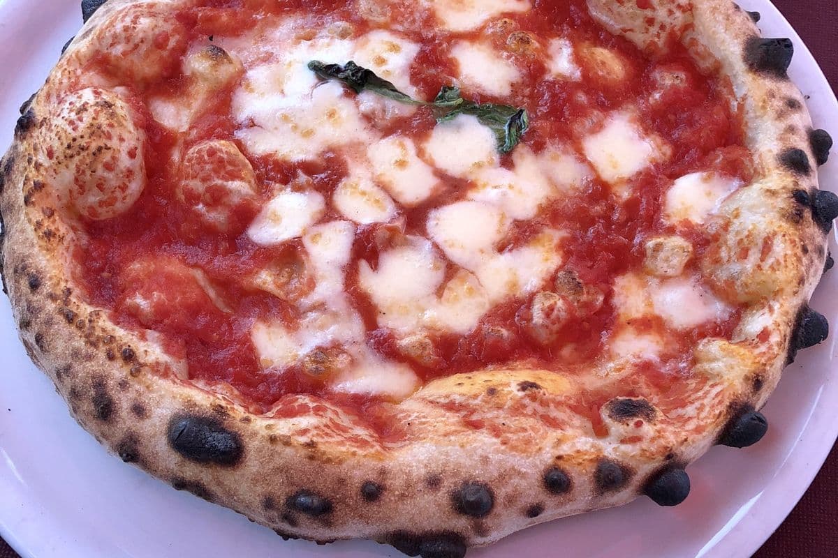 A Neapolitan Margherita pizza with a blistered crust (generic image, not a Rudy's pizza)