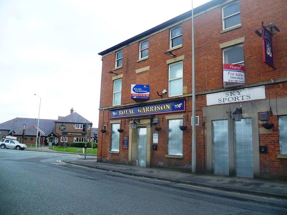 A closed and boarded-up pub