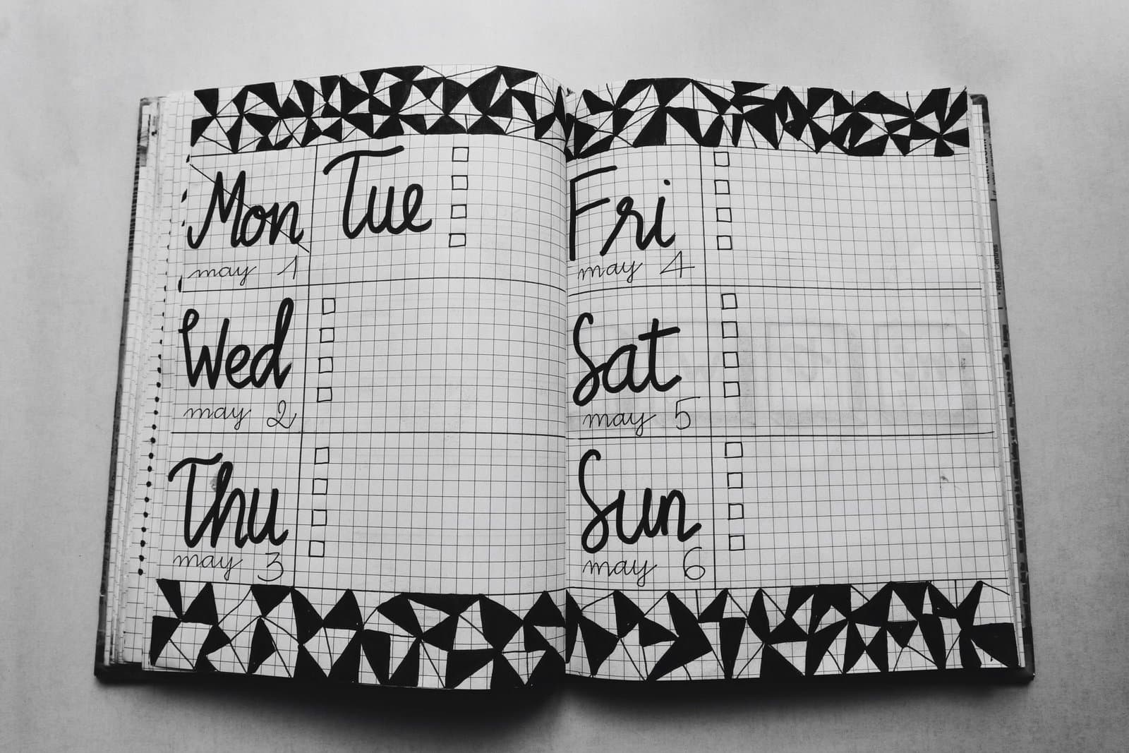 A weekly planner showing the days of the week