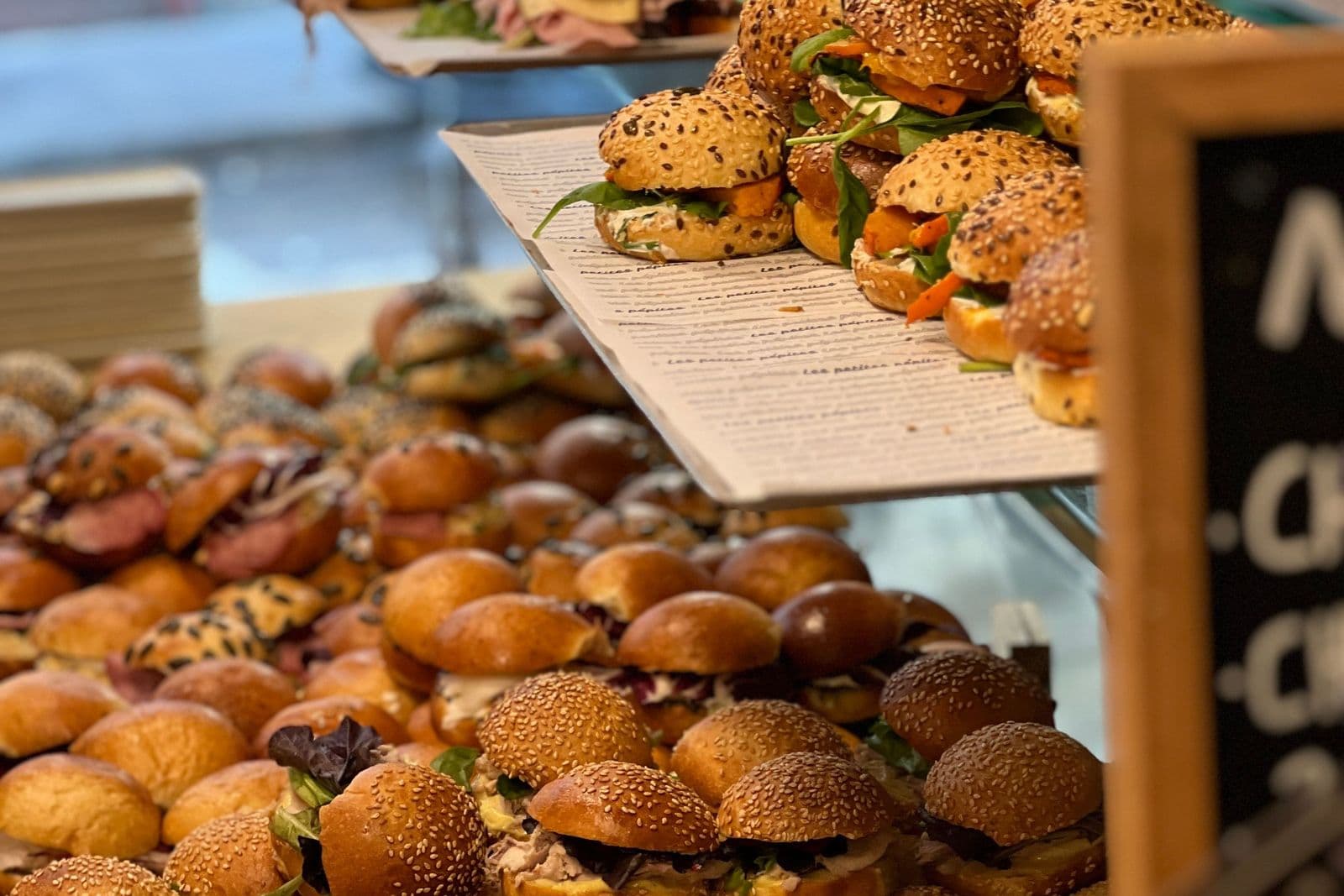 Sandwiches and buns on display in a bakery
