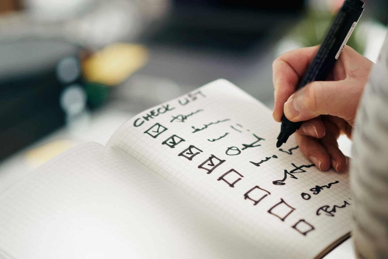 Hand writing tasks on a checklist